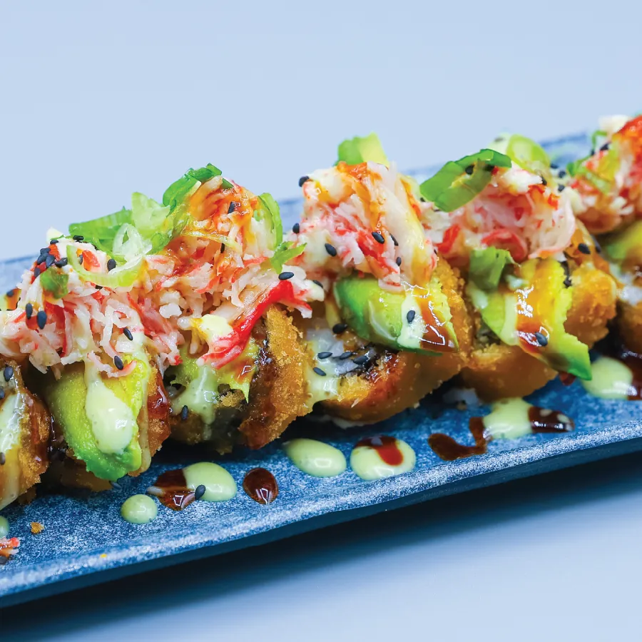Cream cheese, yellow tail, spicy crab, avocado and green onions.