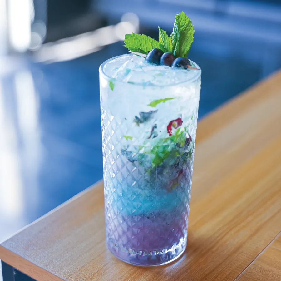 Blue wave mojito with blue berries and mint.
