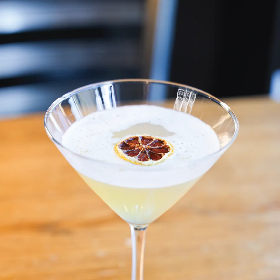 Lychee Martini topped with a dehydrated lemon.