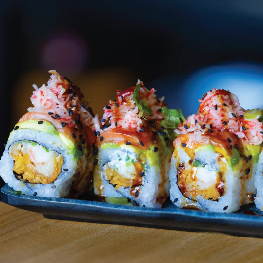 Salmon, crystal shrimp, cream cheese, jalapeno, white onions and green onions.